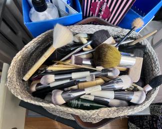 Bin filled with assorted makeup brushes