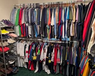 first floor middle bedroom. dozens of sports jerseys. Several signed. 100's of sports shirts