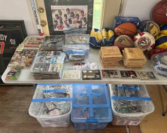 living room west wall. signed cards, signed baseketball floor pieces, signed balls. 1000's of cards, signed photos, rare cards.