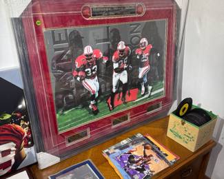 living room to the left of the fireplace. Signed by all three players