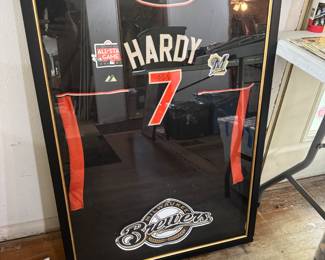 living room west wall. Signed JJ Hardy all star jersey