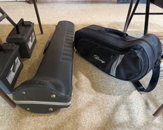 trombone and trumpet (trumpet has damage). kitchen/dining room area under table