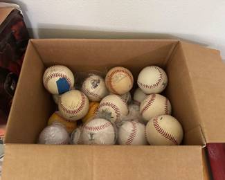 Living room N wall on table. Signed baseballs.