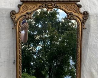 Neo-classical period mirror with power and enlightenment decorative top