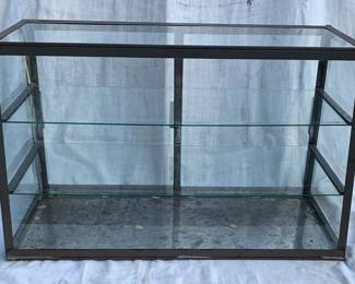 Smaller size countertop display with sliding rear panels.