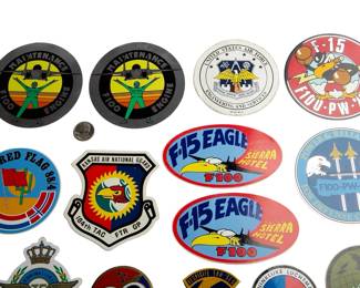 Collection of 12 Vintage Military Aircraft Stickers - F-15 Eagle, USAF Engineering, Red Flag 84, Kansas Air National Guard, Royal Netherlands Air Force, and More