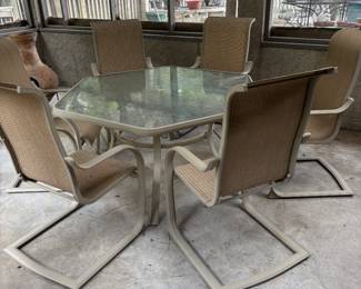 Beautiful glass top table.  Glass has leave design in glass,  6 chairs