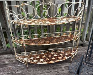 3 Tier metal plant stand.  Shelves fold up.