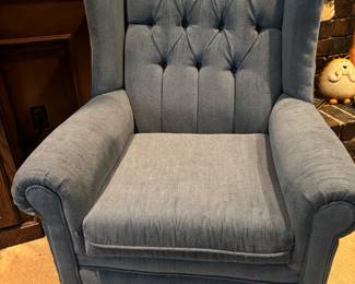 Blue tufted rolled wingback chair with Queen Ann legs. Excellent condition.