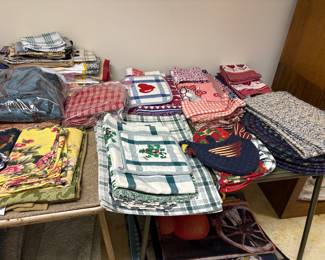Beautiful Placemats, Tablecloths, Napkins, Rugs, Hand towels, Kitchen mitts, Comforter Sets, Blankets, Throws,  Quilted seasonal placemats (Halloween items are so much fun and well done!), lap quilts, runners