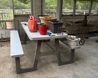 Nice picnic table with various pots.  2 Beverage carts