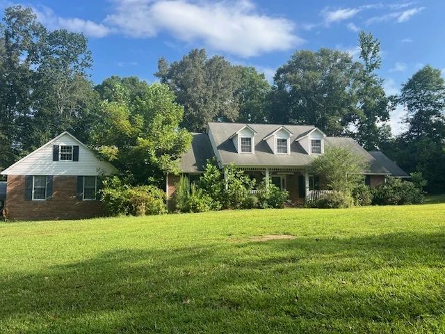 Welcome home to 416 Powers Road, Manchester, Tn 37355 nestled on approx. 8.42 Acres. This brick 4 Bedroom home offers 2.5 baths, huge finished bonus room, big country kitchen w/island, granite countertops, breakfast area, built-in desk, family rm. w/fireplace, patio, attached 2 car garage and detached 2 car garage/workshop.