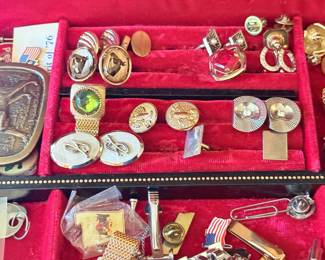 Assorted clip-on earrings and pins