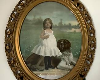 Antique large oval framed print "Playmates" of girl with Burmese dog