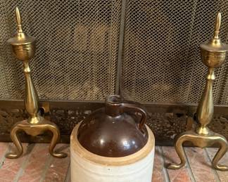 Stoneware jug with brass andirons 