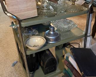 Vintage metal cart with assorted glassware