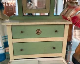 Vintage wooden doll's dresser with pink plastic vanity set