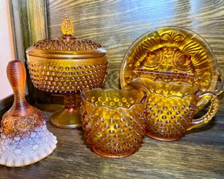 Amber depression glass bell, compote, cream and sugar and serving plates