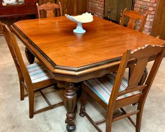 Jacobean style dining table with 4 chairs and 1 captain's chair