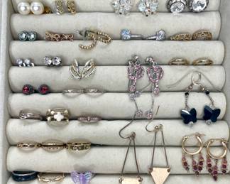 Collection of pierced earrings and rings