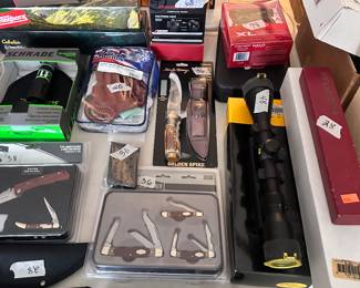 Many knives and gun accessories 