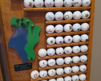 Display cabinet with golf balls. Glenmoor country club hole #7.