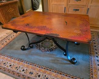 Copper wrapped coffee table with iron base.