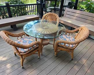 Fabulous Wicker luncheon Cafe table and chairs with very thick glass round top.
(All Wicker furniture pictured outside has always been inside, not used as outdoor furniture!)