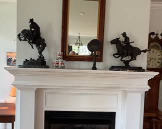 A pair of Frederic Remington Horse & Rider statues - reproduction