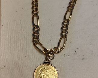 Huge 14kt chain with gold 2..5 dollar coin pendant.