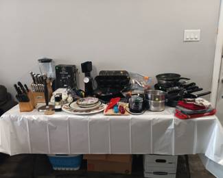 Lots of pots and pans, dishes, cutlery etc.