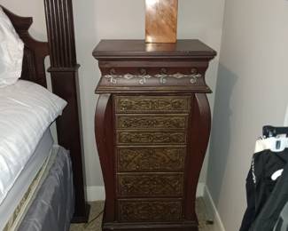 Lamp and antique night stand with hidden jewelry compartments.