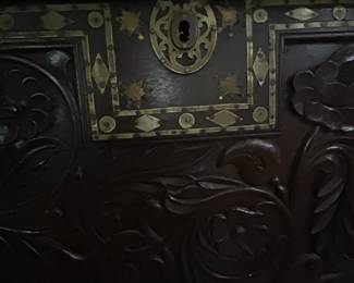 Brass inlay and detail on chest