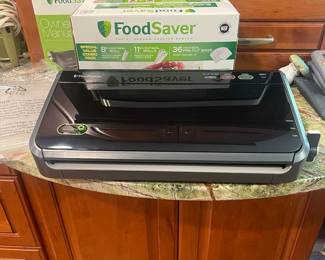 R62 - $75. Food Saver Vacuum Sealer. FM2100-000. Looks brand new! $20 box of food saver bags. 