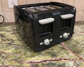 R59 - $10 Oster 4 Slot Toaster. 