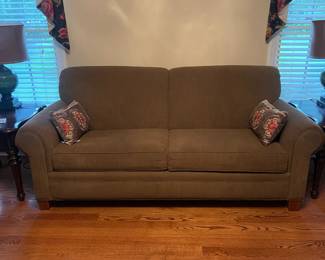 R21 - $250. Broyhill Upholstered Couch - in Brown. Measures 82" long x 27" deep x 36" tall. 