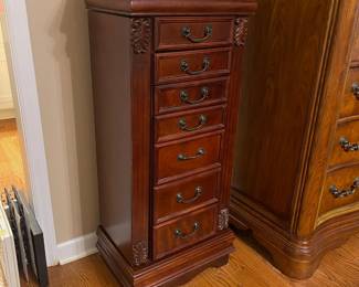 R49 - $100. Stand up Jewelry Box. Measures 18" wide x 12.5" deep x 42" tall. Sides open for necklaces. Drawers all slide. Mirrored top lifts up. In very good condition!