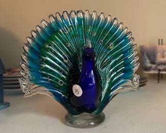 R28 - $15. Glass Peacock. 