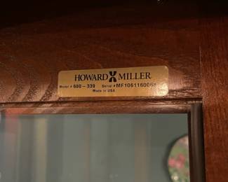 R3 - $225. Howard Miller Lighted Display Cabinet.  Door slides across the front and has a key to lock. Measures 42" at the widest point x 15" deep x 80.5" tall. 