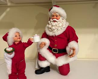 A13 - $25. 2 Pc Clothique. Santa 8.5"T, Child 6" T