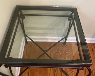 R24 - $35. Iron & Glass Side Table. Glass top is a 20" square x 22.5" tall. Iron frame is slightly wider than the top. 