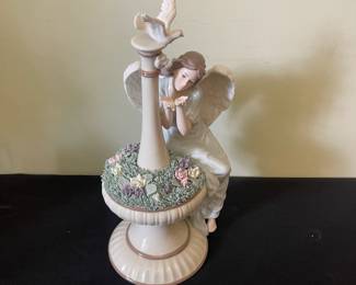 R93 - $25. Porcelain Angel Sculpture. Measures 13.5" tall. 