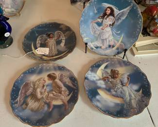 R27 - $20. Set of 4 Sandra Kuck plates "Wonders From Above". 