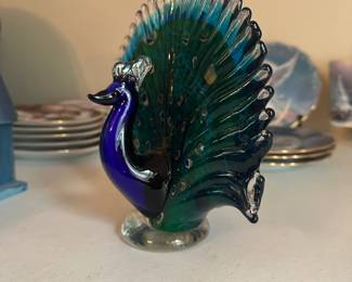 R28 - $15. Glass Peacock. 