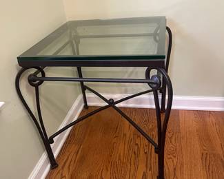 R24 - $35. Iron & Glass Side Table. Glass top is a 20" square x 22.5" tall. Iron frame is slightly wider than the top. 