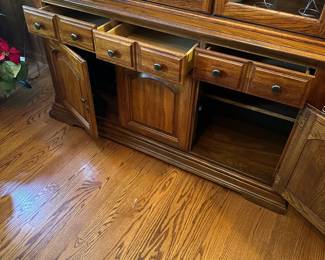R88 - $125. Lenoire House by Broyhill China Cabinet. Moves in 2 pieces. Assembled it is 57" wide x 18" deep x 81" tall.  3 drawers slide easily and both doors open. Wood & Glass shelves are fixed and not adjustable. Very good vintage condition. 
