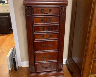 R49 - $100. Stand up Jewelry Box. Measures 18" wide x 12.5" deep x 42" tall. Sides open for necklaces. Drawers all slide. Mirrored top lifts up. In very good condition!