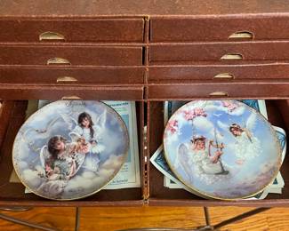 R52 - $50. Sandra Kuck "Always With You" Calendar. Includes wooden framed calendar with days & 12 plates with storage box. Calendar measures 10" wide x 26" tall. 