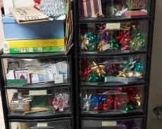 Assorted Christmas Ribbons, Bows And Santa Figurine