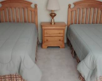 Twin Beds With Bedside Table, Lamp And Framed Art